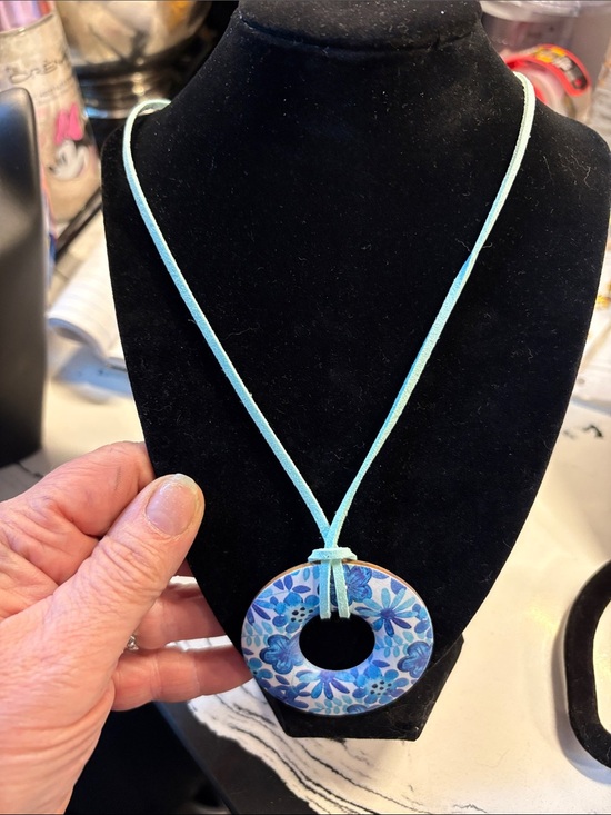 Jewelry - Blue Floral Donut Pendant Necklace on Aqua Suede Cord along with gold earrings